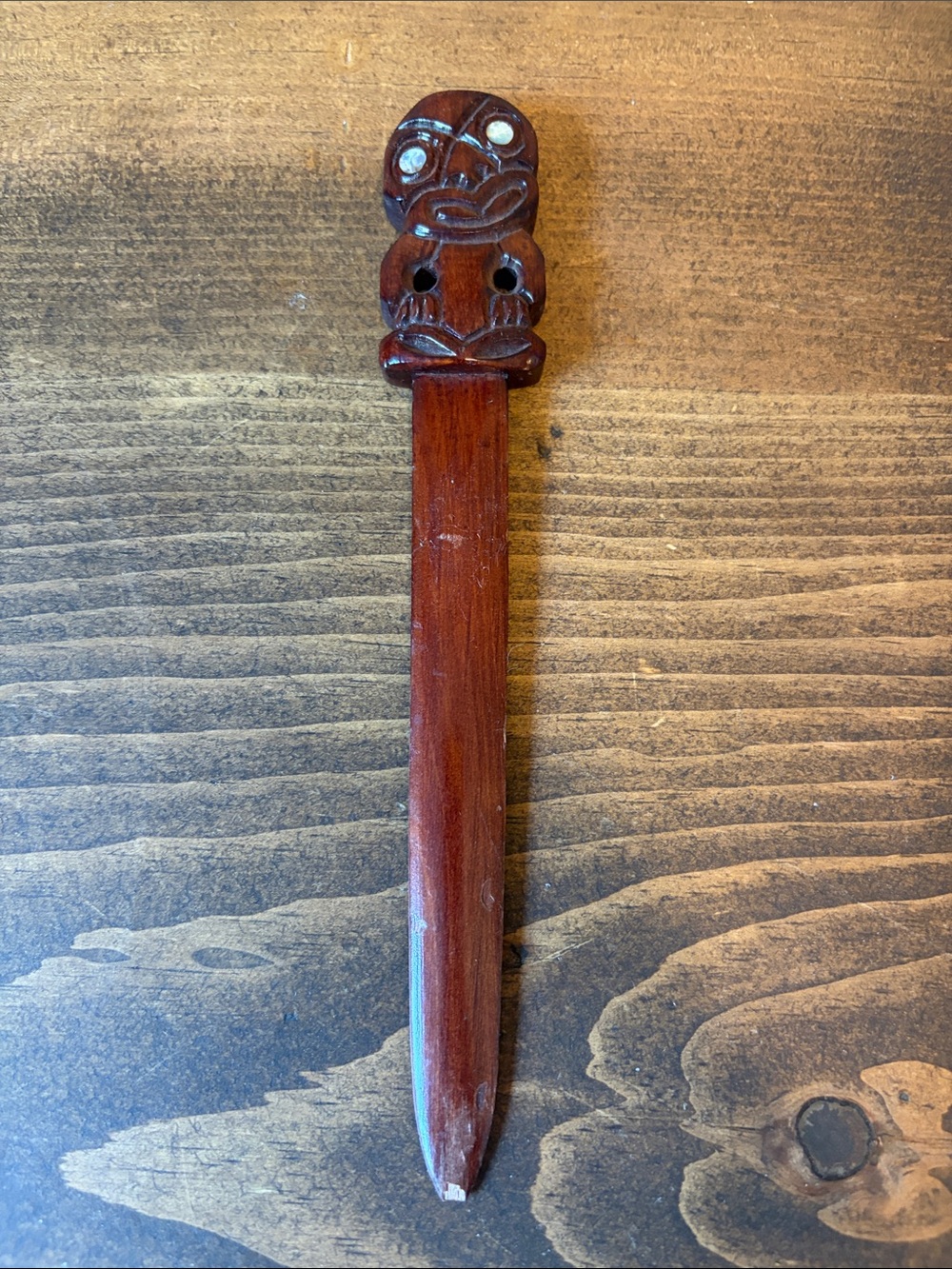Wood Tiki letter opener/hair pin/plant accesory with conch eyes.